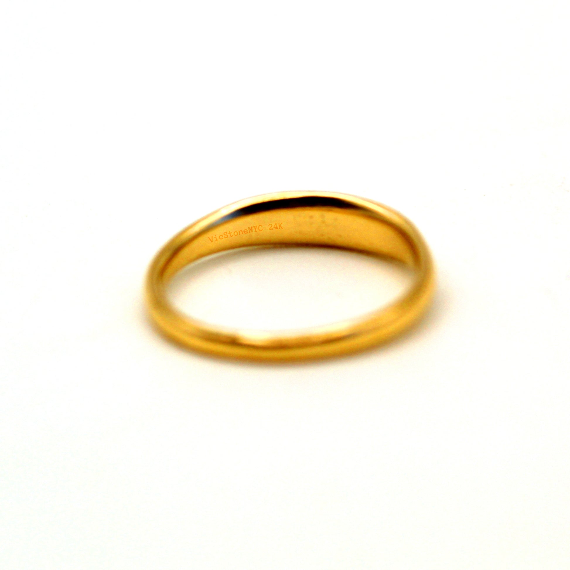 Crafted from the finest 24k gold, this luxury signet ring from VicStoneNYC Fine Jewelry